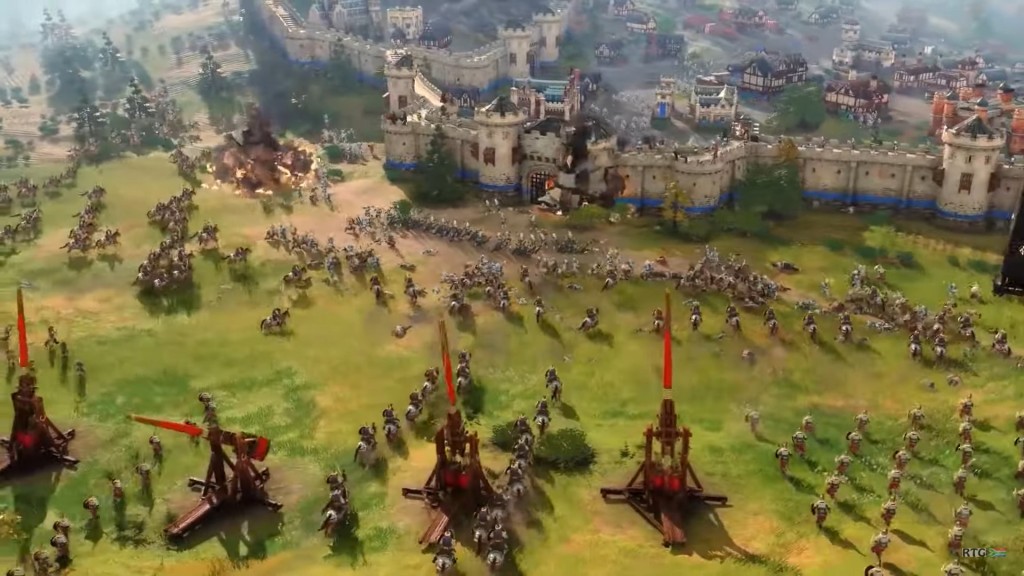 Age of Empires 4 screenshot of siege equipment firing at walls