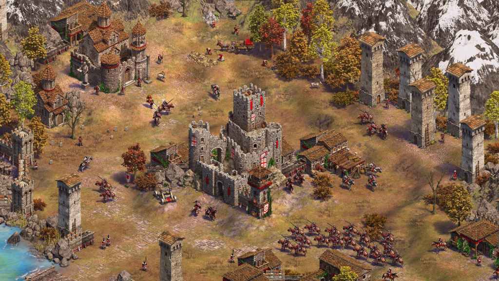 A screenshot from Age of Empires 2 Definitive Edition with a castle and cavalry around it